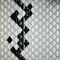 Stylish Black And White Diamond Pattern Tiled Wall Design For Interior Spaces