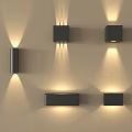 Modern Black Wall Sconces With Up And Down Lighting On Beige Wall 3d model