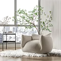 Beige Rounded Single Sofa On White Rug With Black Side Table And City View