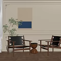 Two Wooden Frame Accent Chairs With Indoor Plant And Wall Art In Elegant Living Room