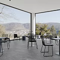 Scenic Cafe Outdoor Terrace With Black Chairs Gray Round Stools And Mountain Town View
