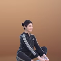 Woman In Black Tracksuit With White Stripes Sitting On Floor With Brown Background