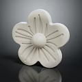 White Flower Shaped Carved Decorative Ornament With Intricate Petal Patterns and Central Circular Detail