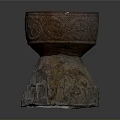 Intricate Sculptural Carving Of Decorative Vessel With Detailed Patterns On Stone Base