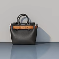 Stylish Black Leather Handbag With Brown Accent Strap And Metal Hardware Details