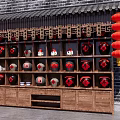 Traditional Wine Display Cabinet With Red Lanterns And Brick Wall Background