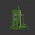 Green Mechanical Equipment with Large Circular Wheel and Metal Frame on Gray Platform