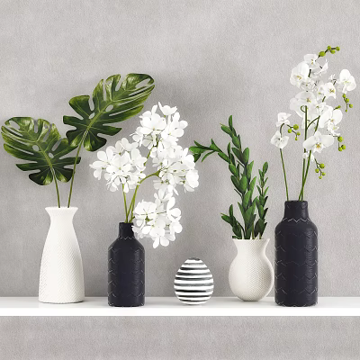 Decorative Vases With White Orchids And Green Monstera Leaves On Shelf Against Neutral Wall 3d model