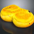 Two Golden Yellow Round Pastries With Shiny Surface And Tasty Filling