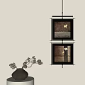Modern Home Decor With Two Framed Artworks And Black Vase Arrangement