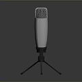 Silver Microphone With Mesh Grille On Tripod Stand For Household Daily Use
