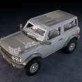 Gray Two Door SUV with Rugged Exterior Design and Large Off Road Tires