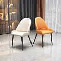 Modern Stylish Dining Chairs With White Orange Upholstery And Black Metal Legs