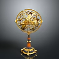 Golden Decorative Armillary Sphere With Brown Marble Base And Ornate Details