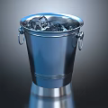 Stainless Steel Ice Bucket Filled With Ice Cubes On Reflective Surface