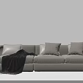 Modern Light Colored Three Seater Sofa With Cushions And Throw Blanket 3d model