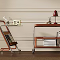 Two Wooden Trolleys With Wheels Shelves Lamp Books And Radio On Cart