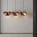 Three Modern Copper Butterfly Shaped Pendant Lights With Warm Glow In Minimalist Interior