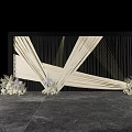 Artistic Floral Art Installation With White Flowers Geometric Drapery And Black Backdrop