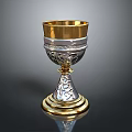 Elegant Gold And Silver Decorative Cup With Intricate Engraved Patterns And Sturdy Base