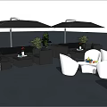 Outdoor Sofa Set With White Chairs Tables Umbrellas And Green Plants In Patio