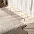 Soft Woven Square Rug On Wooden Floor With Sheer Curtains And Sunlight