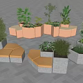 Outdoor Landscape Seating With Concrete And Orange Modular Planters And Green Plants On Paved Ground