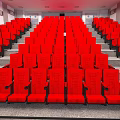 Spacious Cinema Interior With Red Theater Seats Arranged In Neat Rows