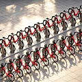 Public Facility Solar Powered Shared Bike Parking With Neatly Arranged Red Bicycles On Stone Pavement