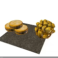 Three Golden Sandwich Cookies And Cluster Of Round Pastries On White Background