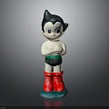 Cartoon Character Figurine With Black Hair Blue Eyes Red Boots And Green Base
