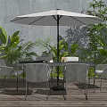 Outdoor Landscape Seating With Table Umbrella Green Plants On Wooden Floor