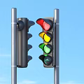 Two Traffic Lights Including Black And Red Yellow Green Lit Ones On Light Blue Background