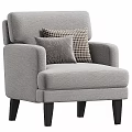 Gray Upholstered Accent Chair with Armrests and Patterned Decorative Pillows on Black Wooden Legs