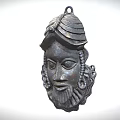 Intricate Traditional Bronze Mask With Detailed Carved Facial Features And Ornamental Headgear