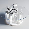 Modern Round Glass Top Coffee Table With White Columnar Base And Decorative Rabbit Figurine