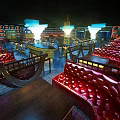 Modern KTV Lounge Interior With Colorful Lighting Tables And Comfortable Sofas