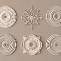 Intricate Carved Plaster Ornaments Featuring Various Circular And Snowflake Ceiling Designs