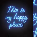 Blue Neon Decorative Light with This is my happy place Text on Dark Background