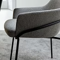 Modern Gray Fabric Dining Chairs With Black Metal Legs And Wooden Wall Light Shadows