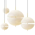 Three Modern Spherical Pendant Lights With White Fabric Shades And Gold Rods