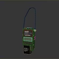 Green Industrial Device With Black Handle And Yellow Information Label