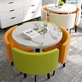 Round Marble Top Table And Colorful Upholstered Chairs Set With Decorative Glass Bottle Tray Notebook