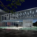 Modern Architectural Building Exterior With Glass Curtain Wall And Night Lighting At Entrance