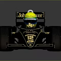 John Player Special Black Racing Car With Gold Logos Yellow Helmet And Large Tires