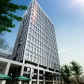 Modern Multiple Office Buildings With Glass Curtain Walls At Waterfront in Evening With Water Reflections