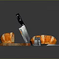 Fresh Homemade Bread on Wooden Cutting Board with Knives Grater and Salt Pepper Shakers