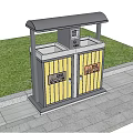 Outdoor Public Trash Bin With Yellow Doors On Stone Pavement Beside Green Grass And Signs