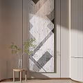 Geometric Pattern Wall Art With Green Plant On Small Wooden Table In Interior