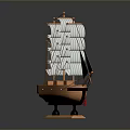 Detailed Wooden Sailboat Model With Multiple White Sails On Black Display Base